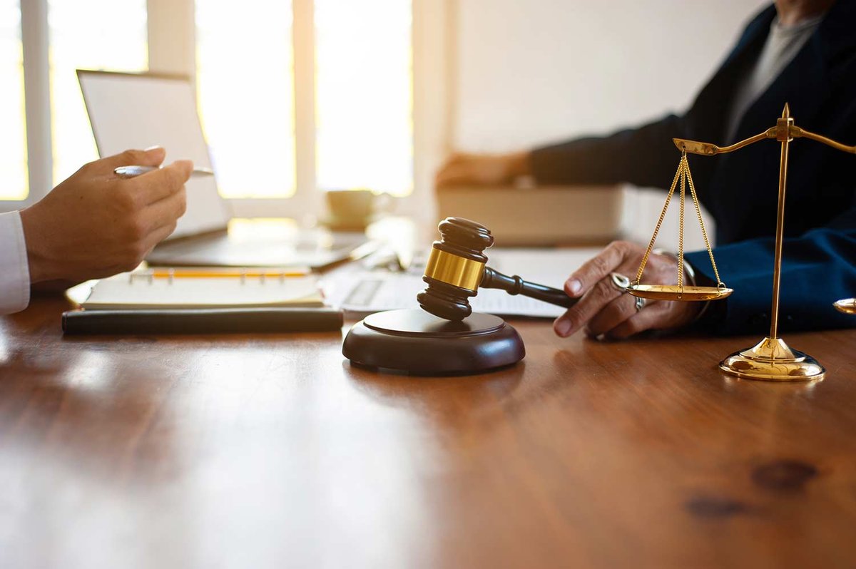lawyer and judge sitting at a table